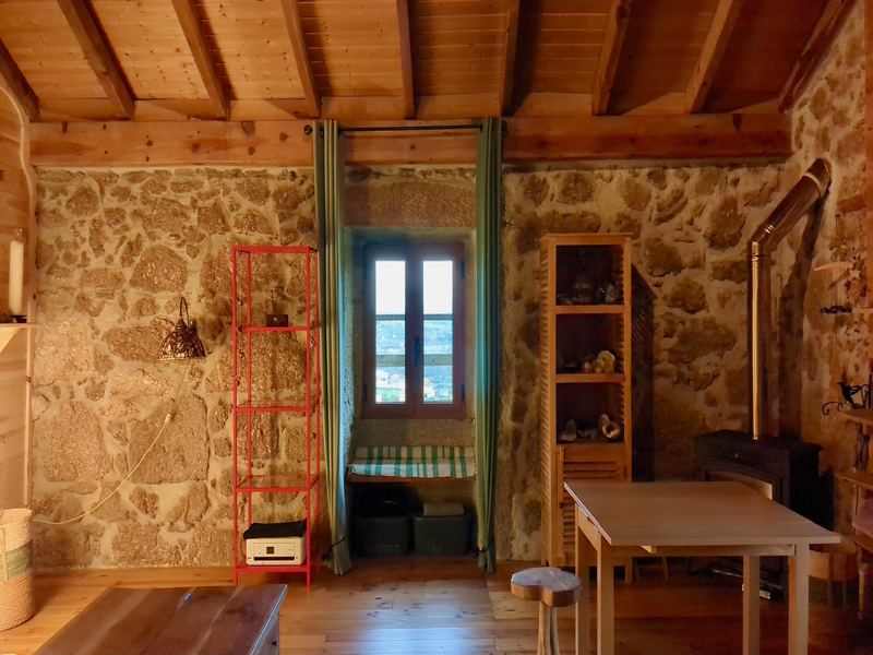 Stone wall interior with wooden ceiling